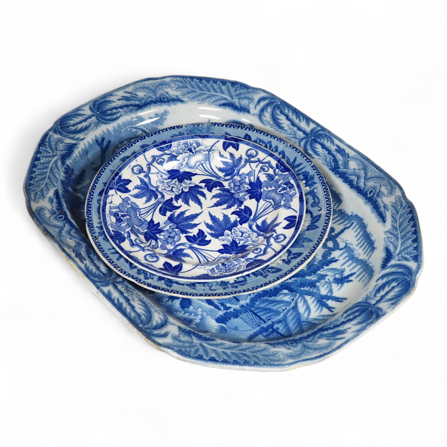 A Victorian blue and white pottery dish and two plates, one Wedgwood, largest 43cm